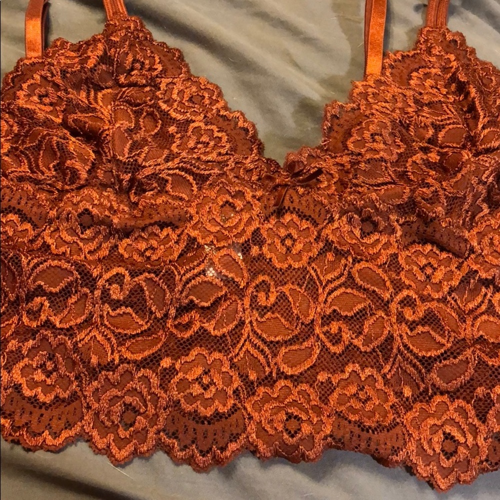 Two pieces Camisole top is XL. Tap pants are 2X.